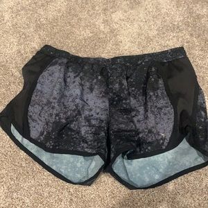 Black and gray athletic shorts.